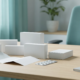 Blank medicine cartons, blister pack and patient leaflet laid out on a desk for labeling review