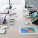 Marketing workspace with abstract campaign mockups and a mirrored right-to-left ad layout